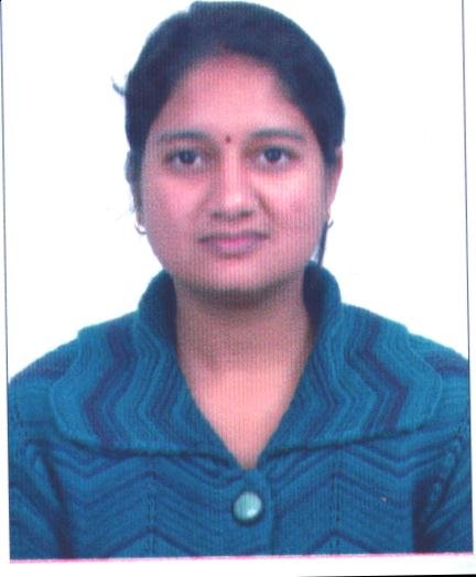 Portrait of Dr. Kapoor wearing traditional attire with academic books in background