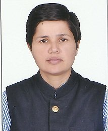 Portrait of Dr. Kapoor wearing traditional attire with academic books in background